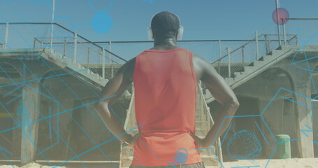 Wall Mural - Image of shapes over african american man with headphones outdoors