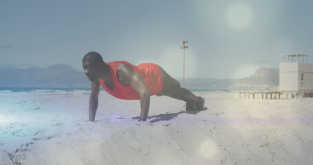 Wall Mural - Image of spots over african american man exercising at beach