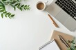 © Tirawat - Modern workspace with laptop, notepad, coffee, and greenery on white background. Ideal for business and creativity concepts.