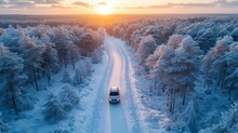Car Drives Through Snow Forest Landscape At Sunset
