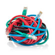 Pile of multi-colored computer patch wires tangled together isolated on a white background