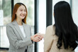 © ijeab - Accepting a business proposal with a handshake.