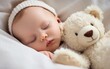 © Dragan - Carefree sleep little baby with a soft toy on the bed.