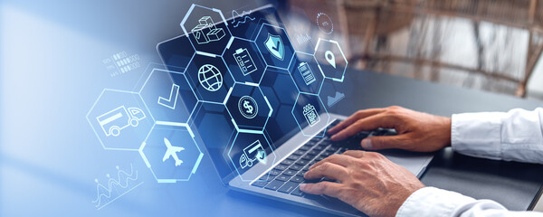 businessman working with laptop, logistics icons on screen, technology concept