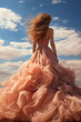 © Michael - Young woman with long hair in a beautiful dress against a blue sky
