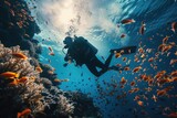 Fototapeta Do akwarium - Scuba diver diving on a tropical reef with blue background and reef fish