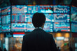 © NUTTAWAT - handsome businessman watching financial analyst working real-time stocks exchange market, broker trading stock market charts with multiple screens