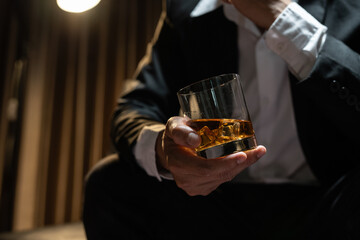 Wall Mural - Businessmen in suits drinking  Celebrate whiskey