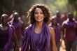 Young smiling woman in purple clothes. Womens rights.