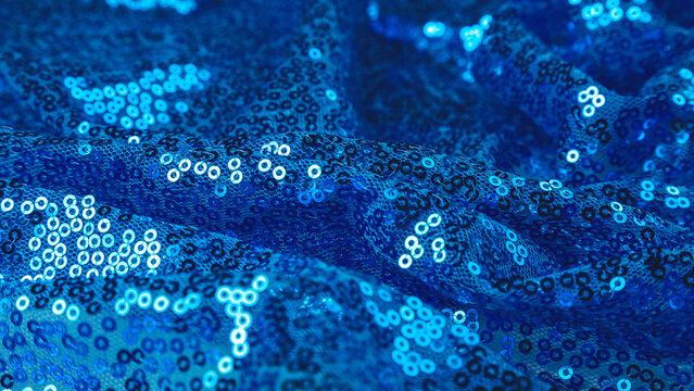 Blue sequins fabrics close up. Selective focus