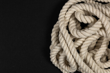 Wall Mural - Rope detail on dark. Close-up of its rope texture Depth of field minimalism ropes