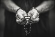 Soulful prayer: a man in quiet devotion, hands clasped around a rosary cross, seeking solace and spiritual connection, capturing the essence of serene contemplation, faith, and religious devotion.