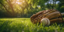 Baseball Glove And Ball On Green Grass With Sunlight In The Morning