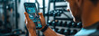 © boyhey - Young fitness setting up smartwatch and smartphone.smartfitness concept