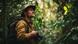 Fototapeta  - Photographer in Jungle, Holding Camera, Wearing Backpack and Hat, Surrounded by Green Foliage