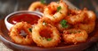 Crispy Seafood Onion Rings Paired with Tangy Sauce, Served as a Gourmet Appetizer on a Wooden Plate