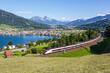 Passenger train type Stadler Giruno of Schweizerische Bundesbahnen SBB at Grosser Mythen mountain at Lake Zug in the Swiss Alps in Arth, Switzerland