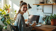© Studio Nova - Young woman is focused on working on her laptop in a modern office