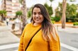 © Krakenimages.com - Young beautiful plus size woman smiling confident standing at street