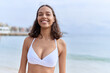 © Krakenimages.com - Young african american woman tourist smiling confident wearing bikini at beach
