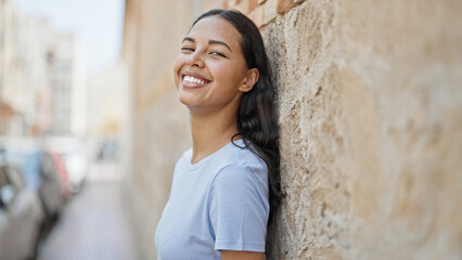 Wall Mural - African american woman smiling confident standing at street