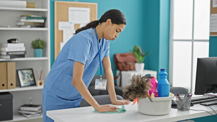 Wall Mural - African american woman professional cleaner cleaning table tired at the office