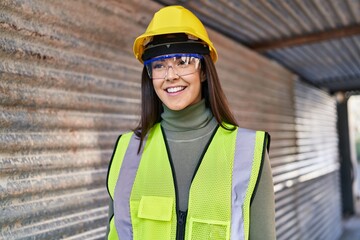 Canvas Print - Young beautiful hispanic woman architect smiling confident standing at street