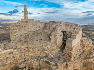 Wall Mural - Aerial view of Castillo de Alcalá or Castillo de La Puebla, Arab castle in Murcia province Spain on top of a flat-top limestone mountain. Large rectangular tower, angled entrance, deep well and cister