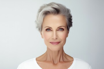 A woman with gray hair wearing a white shirt. Suitable for various uses