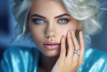 A Woman With Striking Blue Eyes Wearing A Ring On Her Finger. Perfect For Wedding Or Engagement-related Projects