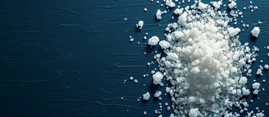 Canvas Print - Salt Concept on Dark Blue Background: Enhancing the Salty Experience with a Captivating Concept on a Moody Dark Blue Background