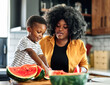 © Lumos sp - child family kitchen food boy son father mother watermelon fruit slice summer organic meal fun preparing healthy diet eating home black