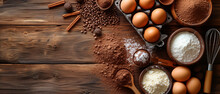 Baking Ingredients - Flour, Eggs, Sugar, Cocoa Powder, Rolling Pin And Whisk On Wooden Background
