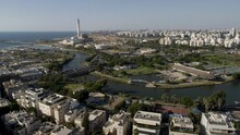 Aerial Footage Of The Yarkon River With The Sailing Center Of Tel Aviv, In The Background The Power Plant For The Shores Of The Mediterranean Sea