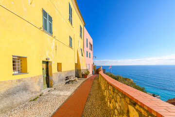 Wall Mural - A terrace overlooks the blue Mediterranean Sea at the hilltop medieval town of Cervo, Italy, in the Imperia Province along the Ligurian Coast.