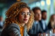 © Cary - woman glasses sitting table people strong confident personality low depth field effect short curly blonde haired girl laser focus well dressed proud look interconnections