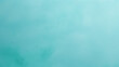 An minimalist turquoise background with copy space