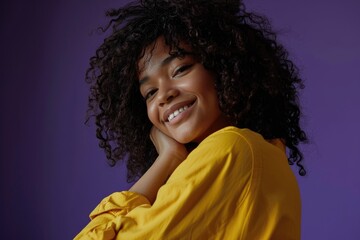 Wall Mural - Happy African American woman hugs herself to cheer up and fight loneliness.