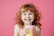 © thejokercze - Happy child drinking milkshake on color background