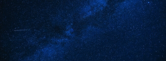 Wall Mural - stars background a blue starry sky at dark night
