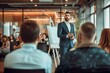 © Adobe Contributor - Businessman giving a presentation to a group of people in a conference room