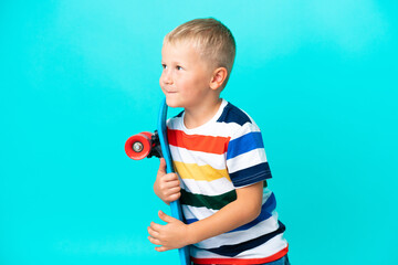 Wall Mural - Little skater Russian boy over isolated background