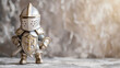 A courageous little knight wearing shiny armor, standing against a silver background.