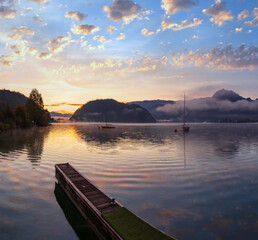 Wall Mural - Peaceful autumn Alps mountain lake. Sunrise Wolfgangsee lake view, St. Wolfgang im Salzkammergut, Upper Austria.