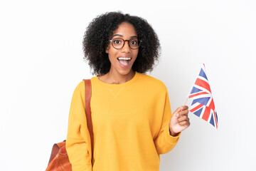 Sticker - Young African American woman holding an United Kingdom flag isolated on white background with surprise facial expression