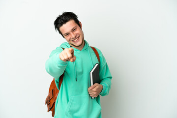 Wall Mural - Young student man isolated on white background pointing front with happy expression