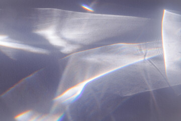 Wall Mural - sunlight background, abstract photo with light and shadow, glare and shine on paper texture, rainbow
