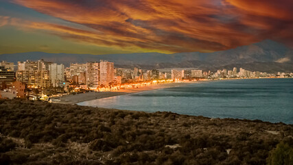 Canvas Print - View of San Juan beach and water front buildings on the Mediterranean coast of Alicante, Spain, at dusk