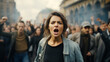 © Natalia Klenova - A young woman shouts a cry against the backdrop of a crowd of people