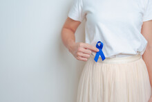 Woman Holding Blue Ribbon With Having Abdomen Pain. March Colorectal Cancer Awareness Month, Colonic Disease, Large Intestine, Ulcerative Colitis, Digestive System And Health Concept